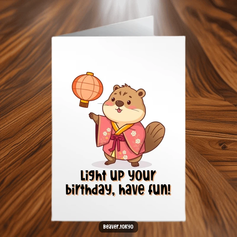 Free Printable Beaver Birthday Card: Happy beaver in a colorful kimono tosses a paper lantern, celebrating your birthday.